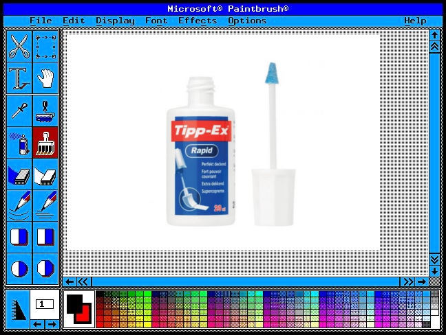 paintbrush y bote de típex